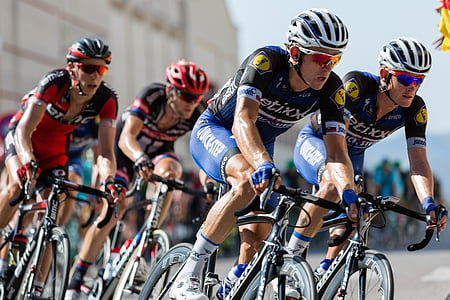 photo of bicycle racer during daytime thumbnail