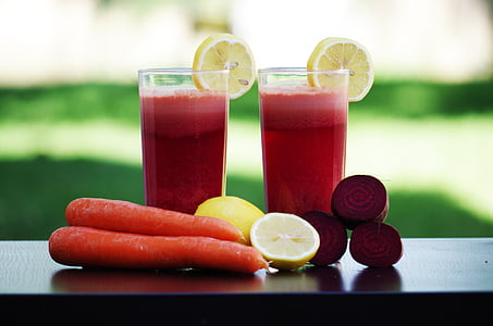 selective focus photography of vegetable and fruit juice glasses on black table thumbnail