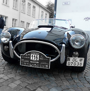 classic black Shelby Cobra 427 on concrete pathway during daytime thumbnail