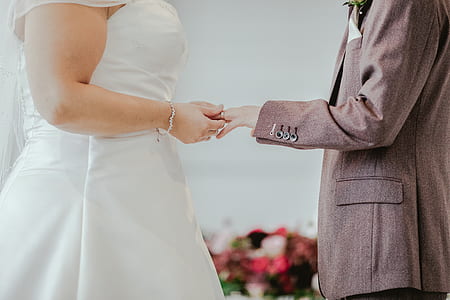 man facing woman while holding her hand thumbnail