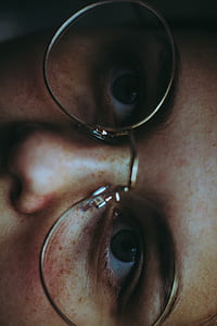 man wearing eyeglasses in close up photography thumbnail