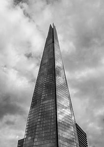 clear glass high-rise building under cloudy sky thumbnail