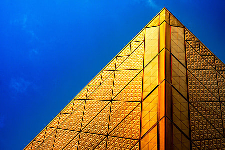 low-angle photo of yellow building at daytime thumbnail