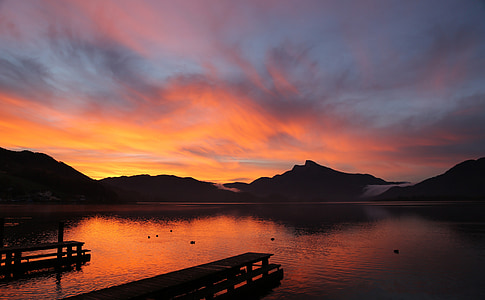 photo of dock and mountain during golden hour thumbnail