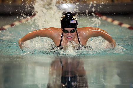 swimmer athlete using butterfly swim on competing pool thumbnail
