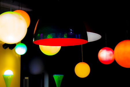 assorted-color pendant lamps hanging on ceiling thumbnail