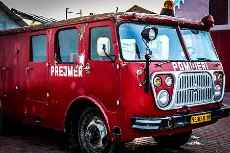 red fire truck under blue skies during daytime thumbnail