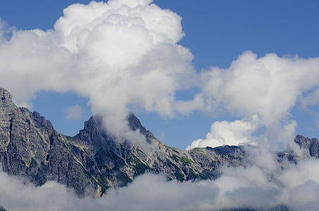 white clouds near mountain thumbnail