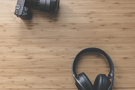Black Headphones Near Dslr Camera thumbnail