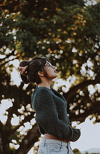 standing woman near tree at daytime thumbnail