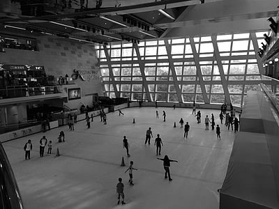 people standing ice skate ring thumbnail
