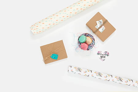 macaroons in between two brown boxes thumbnail