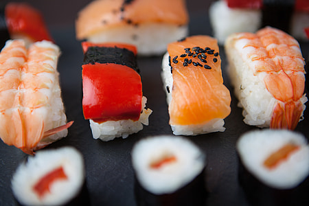 Close-up macro shot of fresh sushi fish resting on a slate thumbnail
