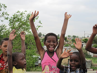group of children raising hands thumbnail