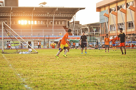people playing soccer on field thumbnail