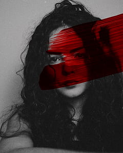 grayscale photo of woman with red paint line thumbnail