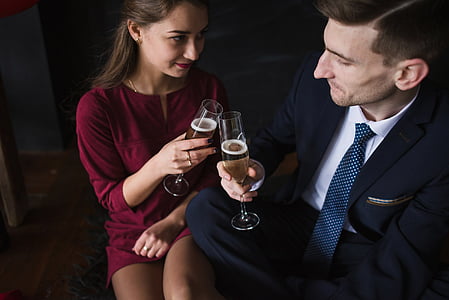 man and woman toasting champagne glass thumbnail