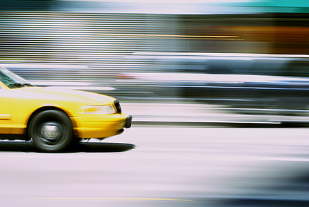 time lapse photography of yellow car thumbnail