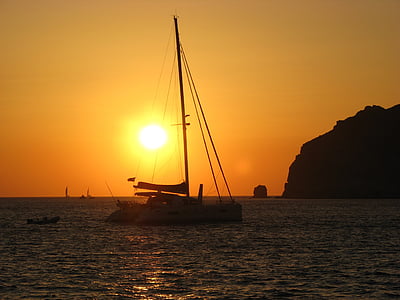 white boat floating on body of water thumbnail