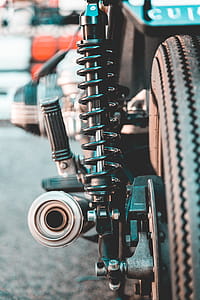 Selective Focus Photography of Black Metal Coilover thumbnail