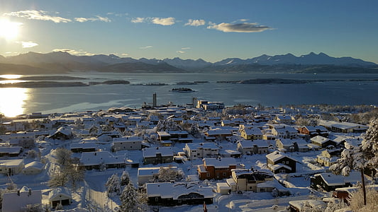 white houses near the body of water thumbnail