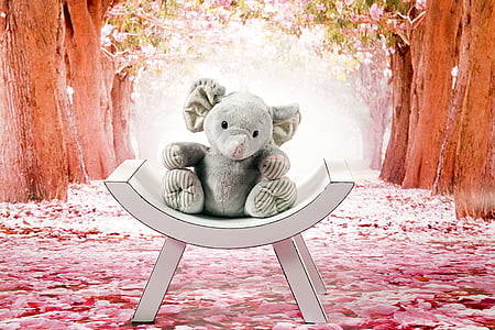 elephant plush toy on white wooden chair thumbnail