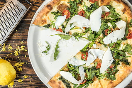 pizza with green leafy vegetable toppings thumbnail