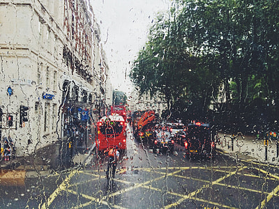 man near red bus during daytime thumbnail