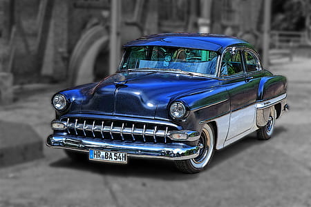 selective color photography of vintage blue and white coupe thumbnail
