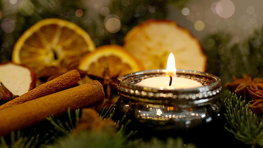 white tealight candle inside stainless steel holder thumbnail