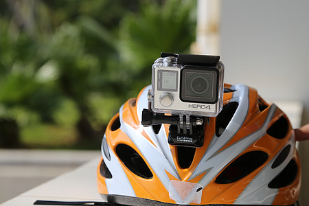 silver GoPro HERO4 on top of helmet thumbnail
