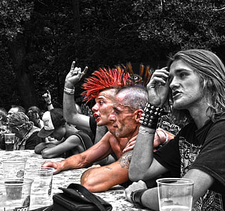 selective color photography of group of men sitting in front of table thumbnail