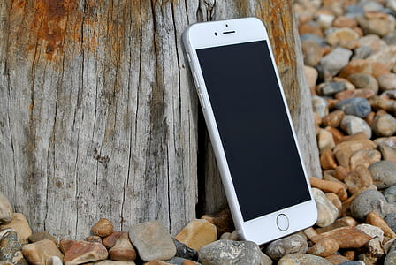 Silver Iphone 6 on Gray and Brown Stone thumbnail