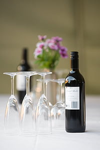 selective focus photograph of wine bottle and glass on white surface thumbnail