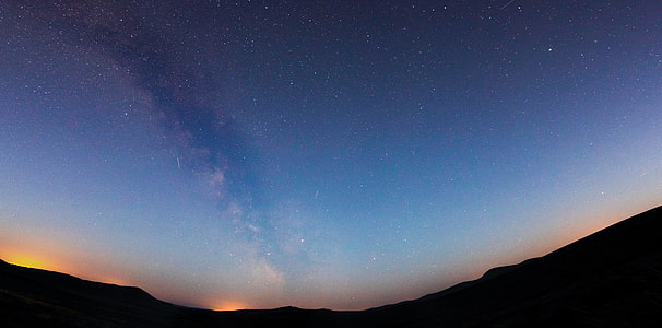 silhouette of mountain under stars thumbnail