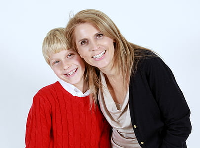 woman beside boy in red sweater thumbnail