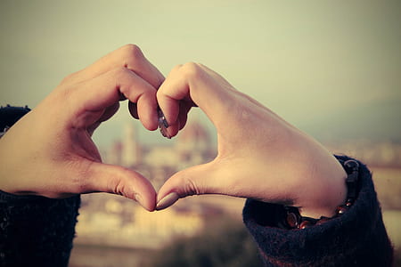 photo of person forming hand heart sign thumbnail