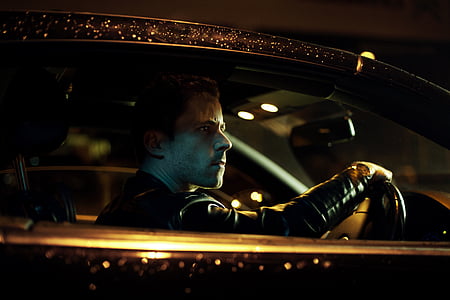 man wearing black jacket riding car thumbnail