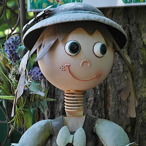 boy model figure beside tree trunk thumbnail