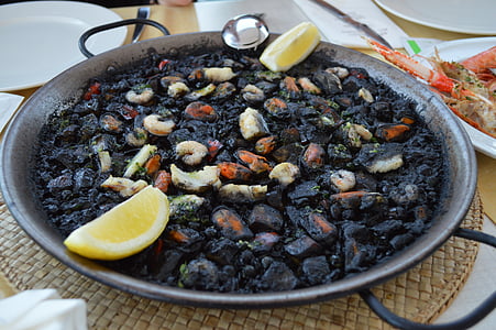 cooked food on wok near plates thumbnail
