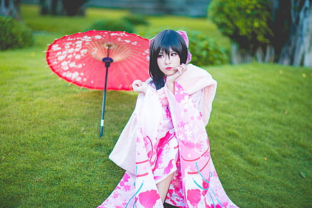 woman wears pink and white floral kimono thumbnail