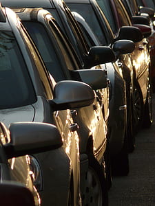 photo of parked assorted-color vehicles thumbnail