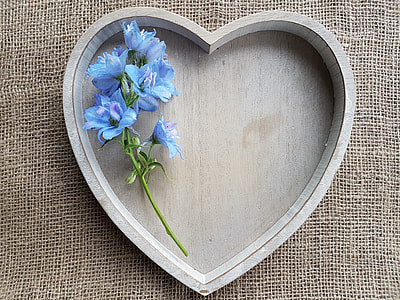 close up photo of gray wooden heart-shaped tray on brown textile thumbnail