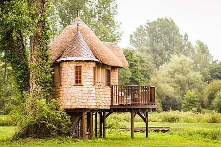 brown wooden hut with balcony thumbnail