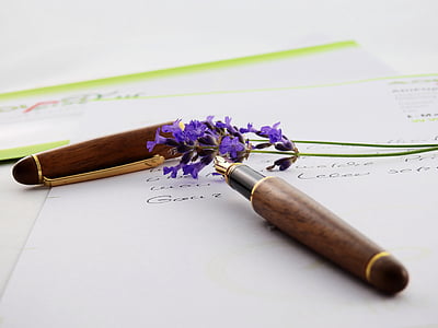 brown fountain pen on white printer paper thumbnail