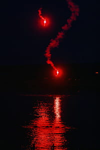 Survival signal red flares over water thumbnail