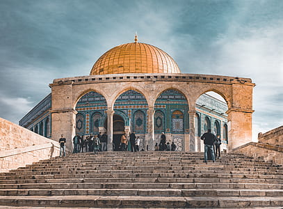 photo of people walking towards temple thumbnail