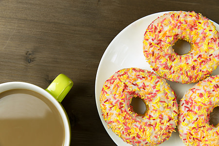 Cup of coffee and iced donuts thumbnail