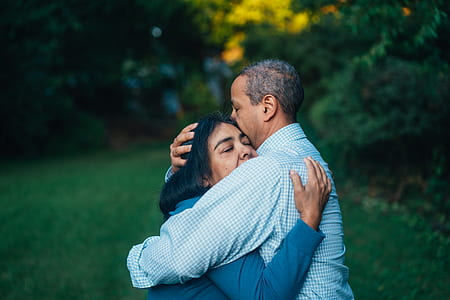 man hugged woman surrounded by trees thumbnail