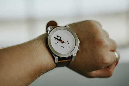 round silver-colored analog watch displaying 11:50 thumbnail